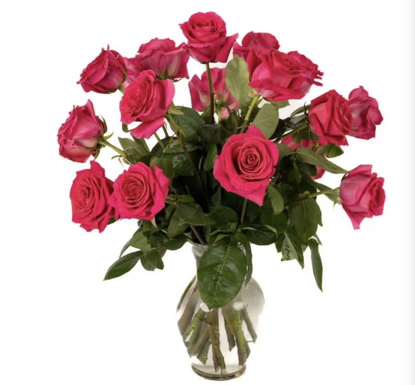 Bouquet of hot pink roses in a clear glass vase