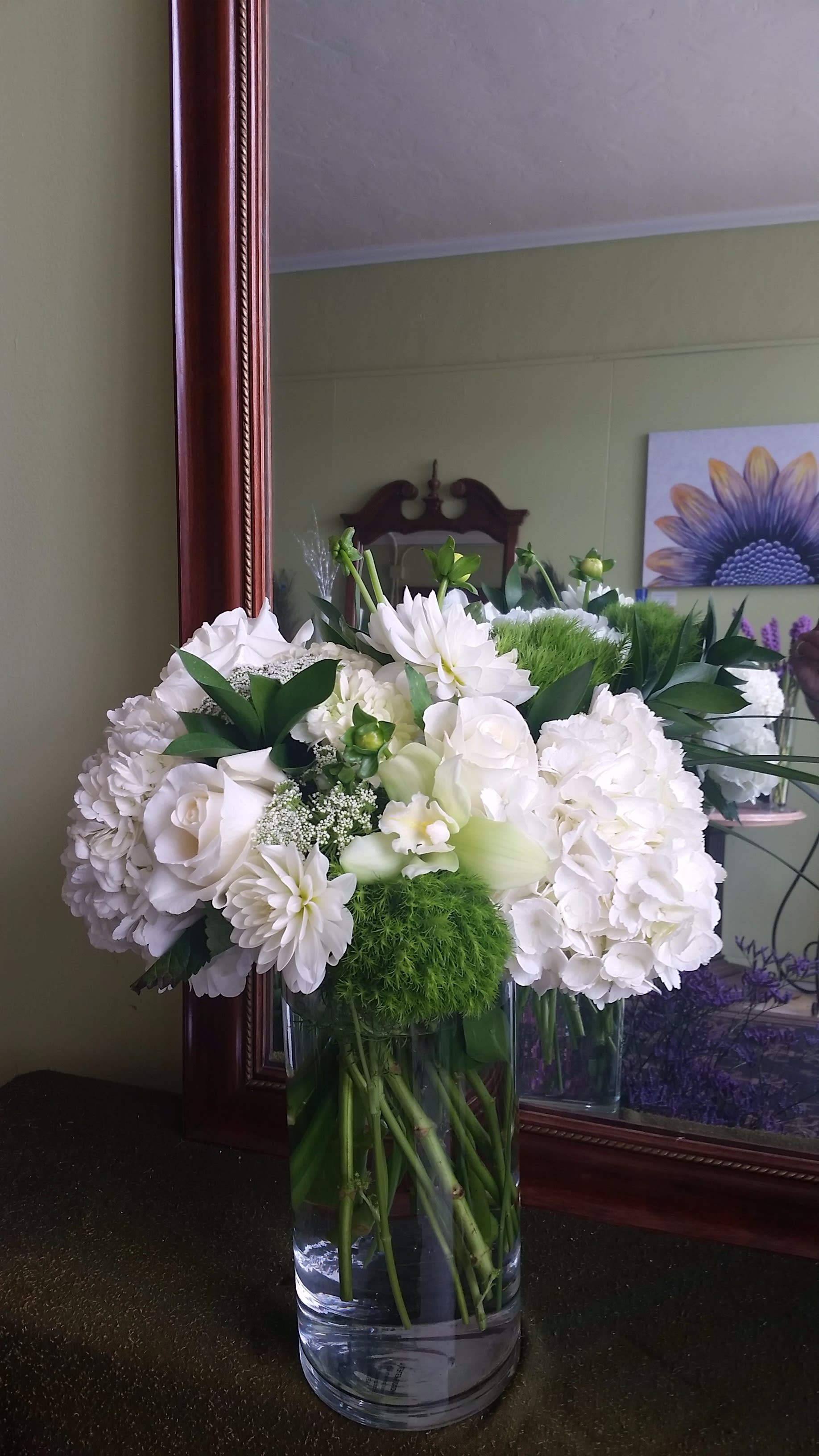 White floral arrangement in a clear glass vase