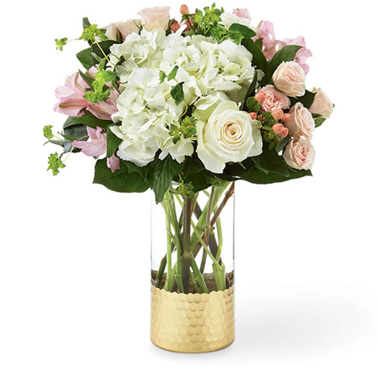 Simply Gorgeous Bouquet - Simply Gorgeous™ Bouquet is a gift they will simply never forget. This fresh bouquet is filled with blushing, beautiful texture and soft pastel hues to complement any message of love. It's handcrafted with spray roses, roses and hydrangea in a glass vase for your special people. Bouquet is approximately 16"H x 14"W