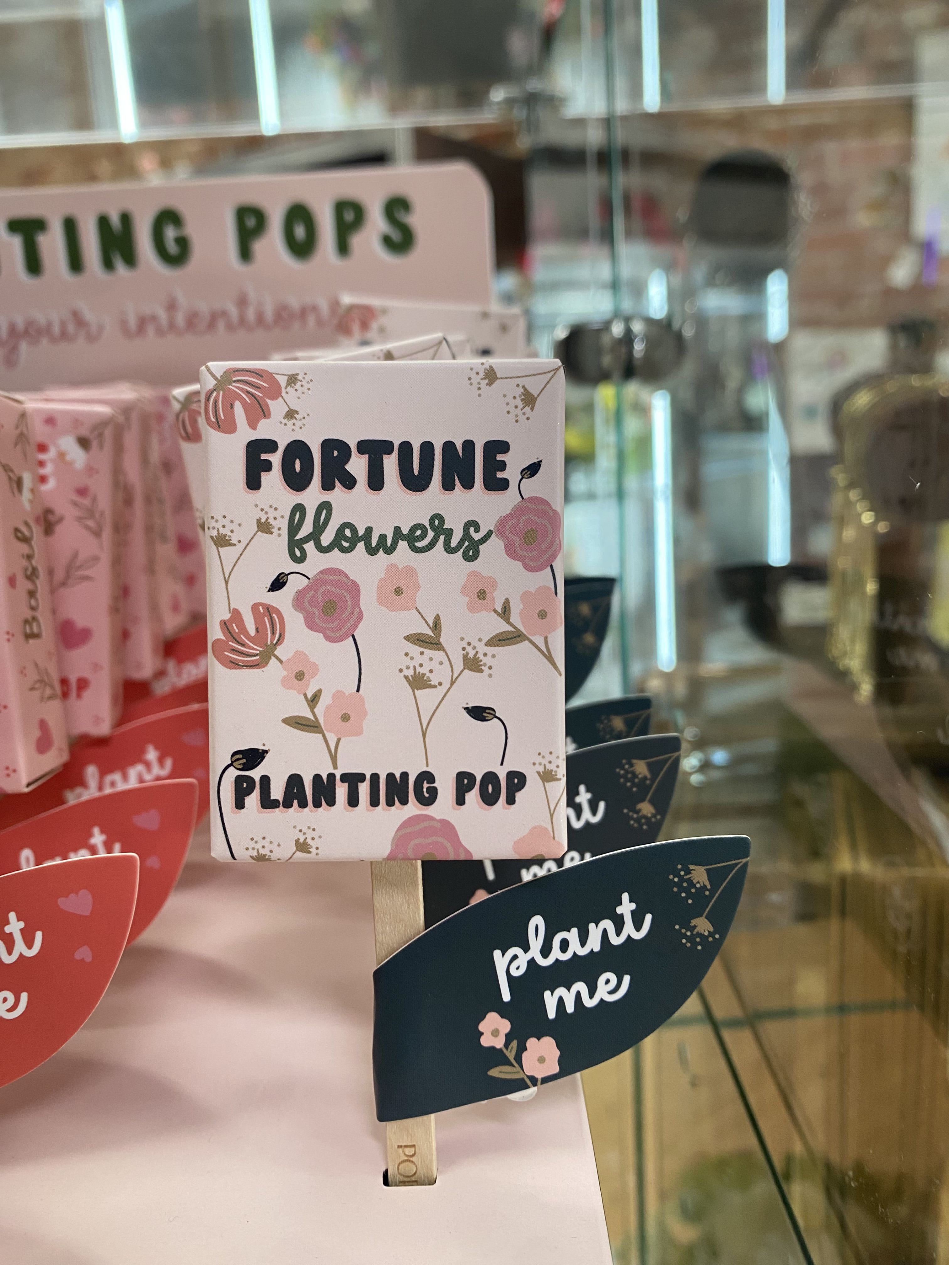 Decorative plant gift boxes with floral prints and "fortune flowers" text