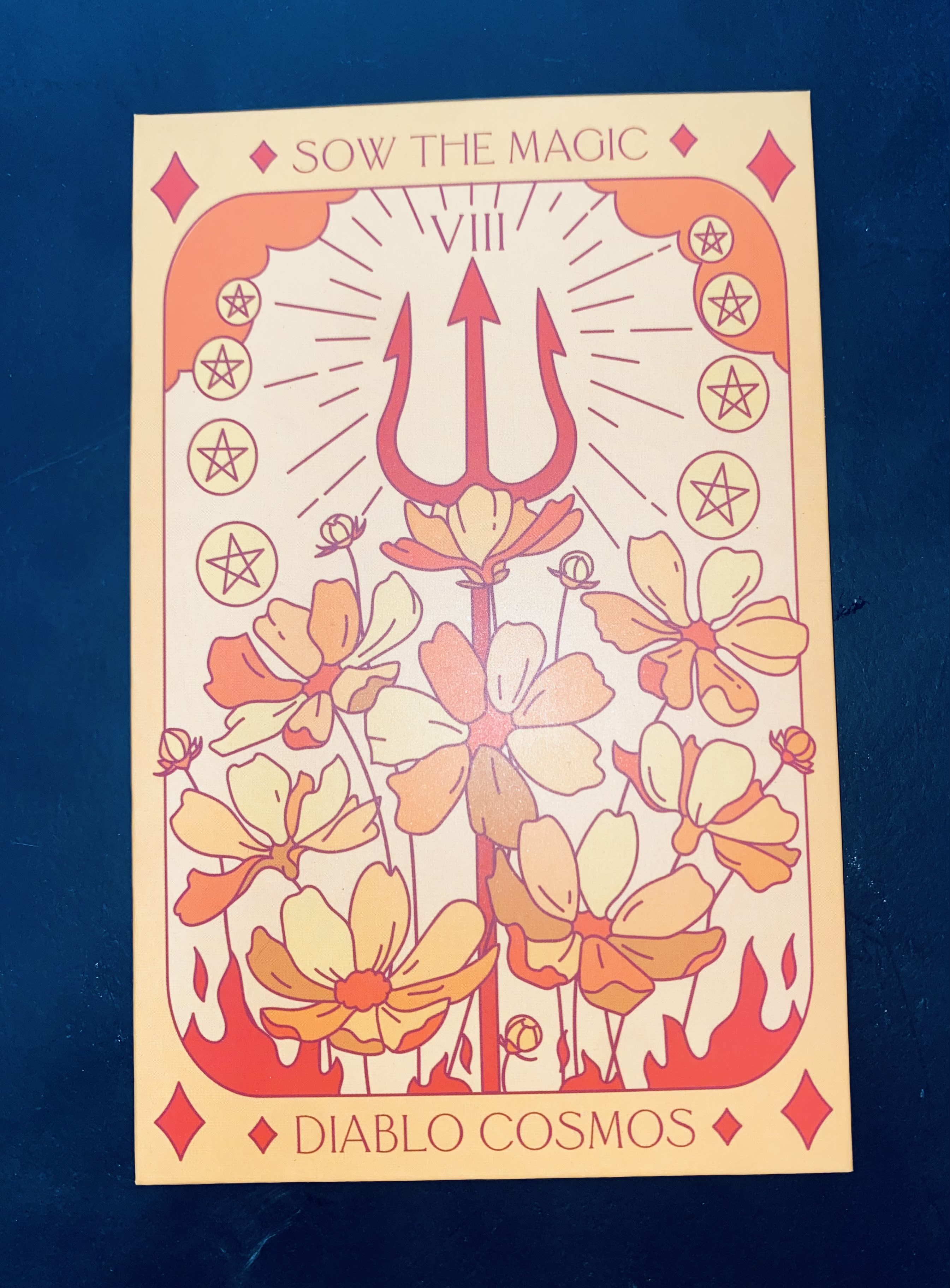 Illustrated tarot-style card with flowers and a trident