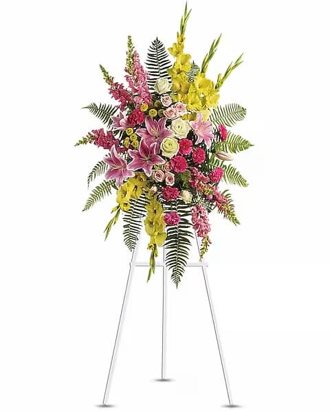 Tall standing floral spray with pink, yellow, and white flowers
