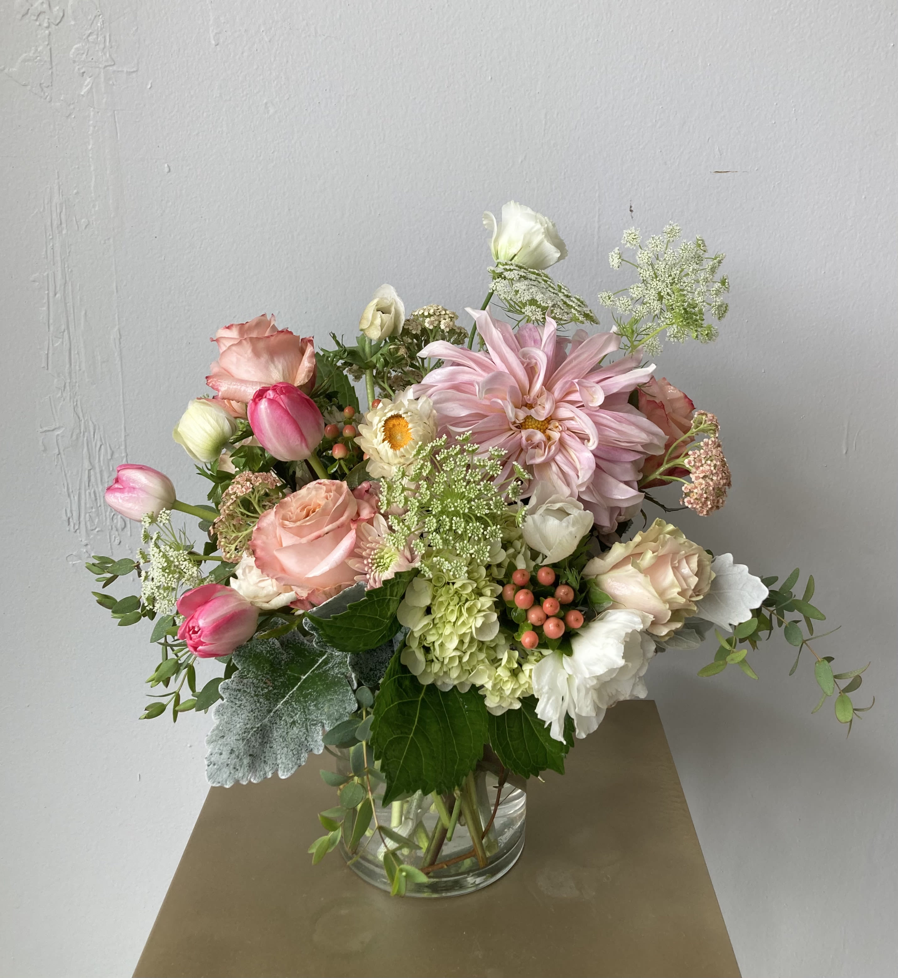 Pink and white mixed bouquet in a clear glass vase