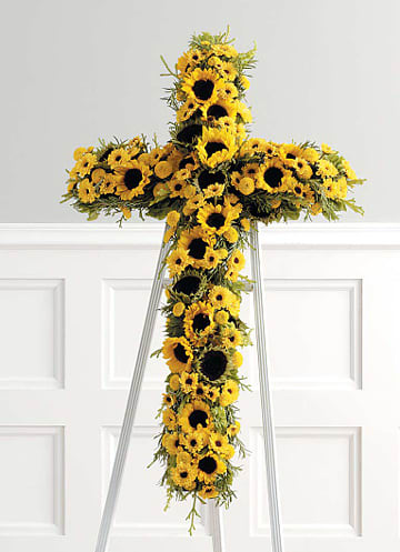 Yellow sunflower cross on a metal stand