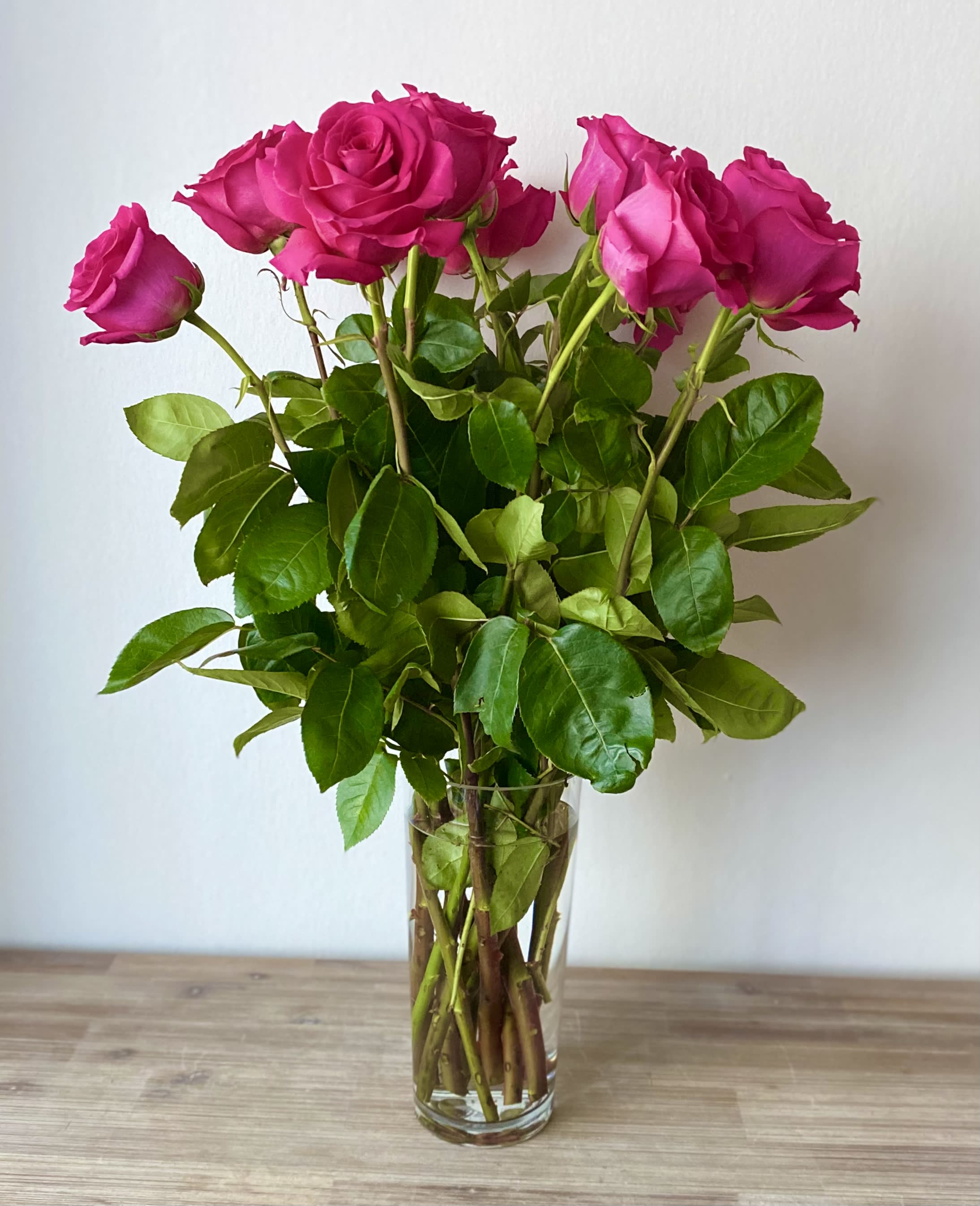 Pink roses in a clear glass vase