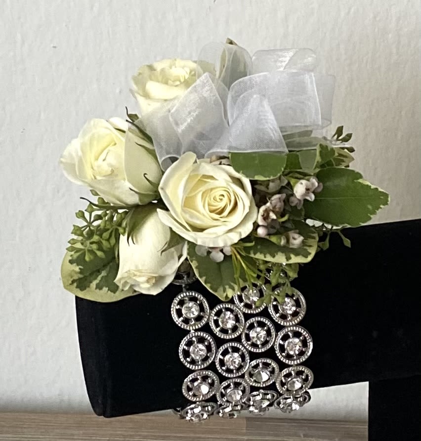 Cream roses with greenery and a jeweled black wrap
