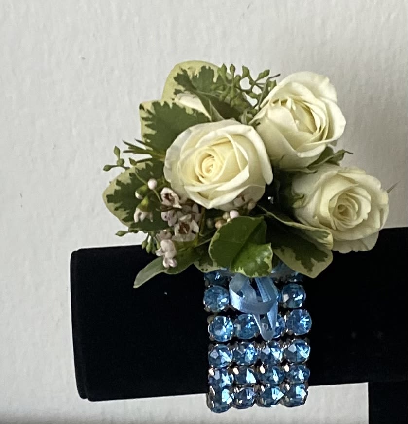 White rose corsage with blue jeweled wristband