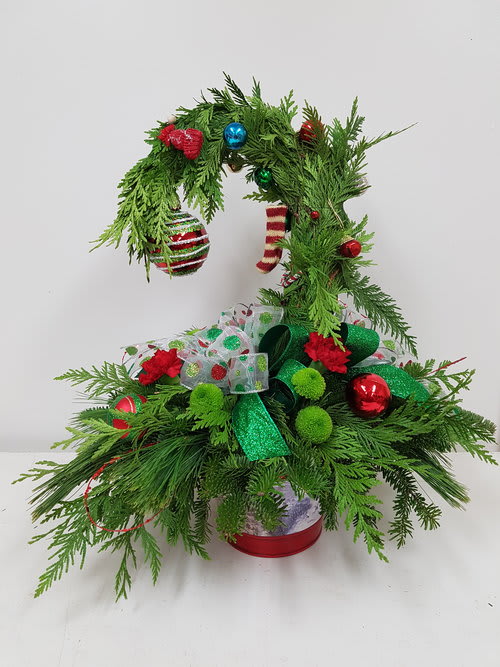 Christmas tree-shaped evergreen arrangement with ornaments and ribbon