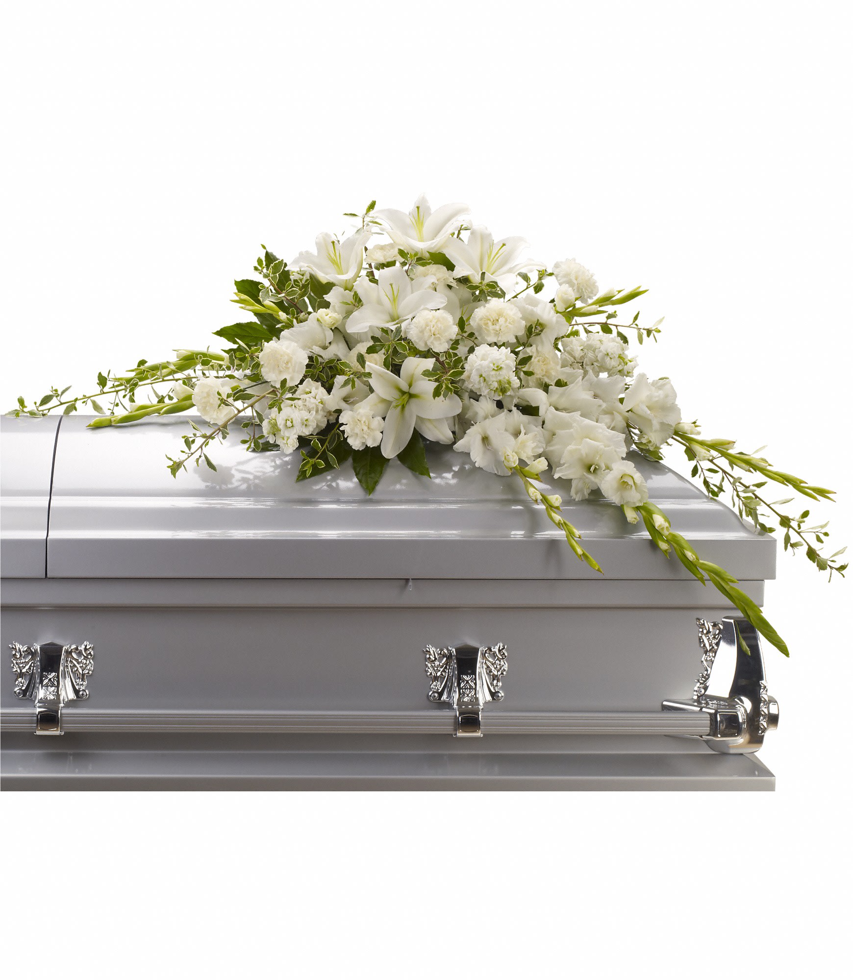 White lily and carnation casket spray arranged on a light gray casket