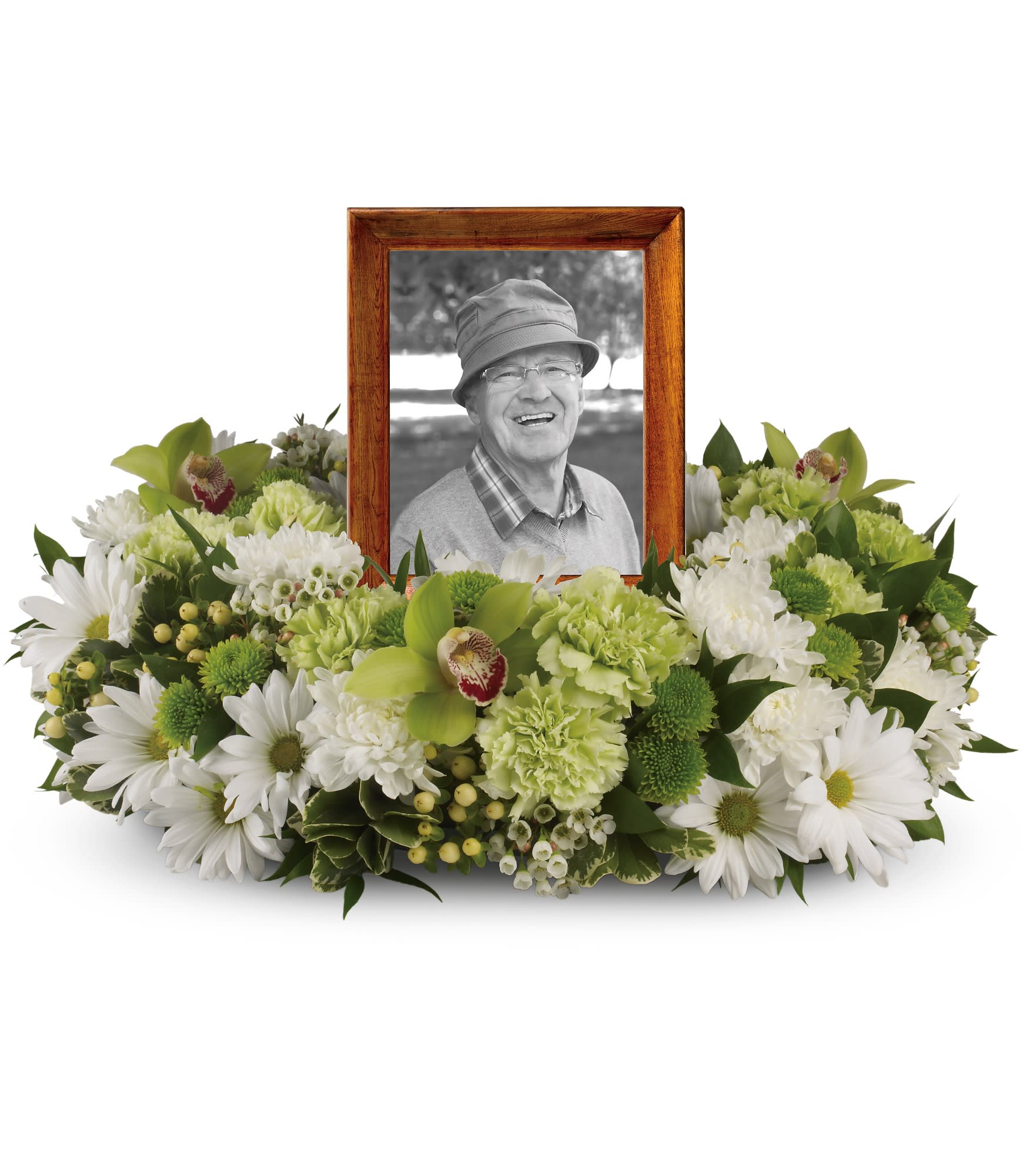 Round white and green floral wreath encircling a wooden-framed portrait.