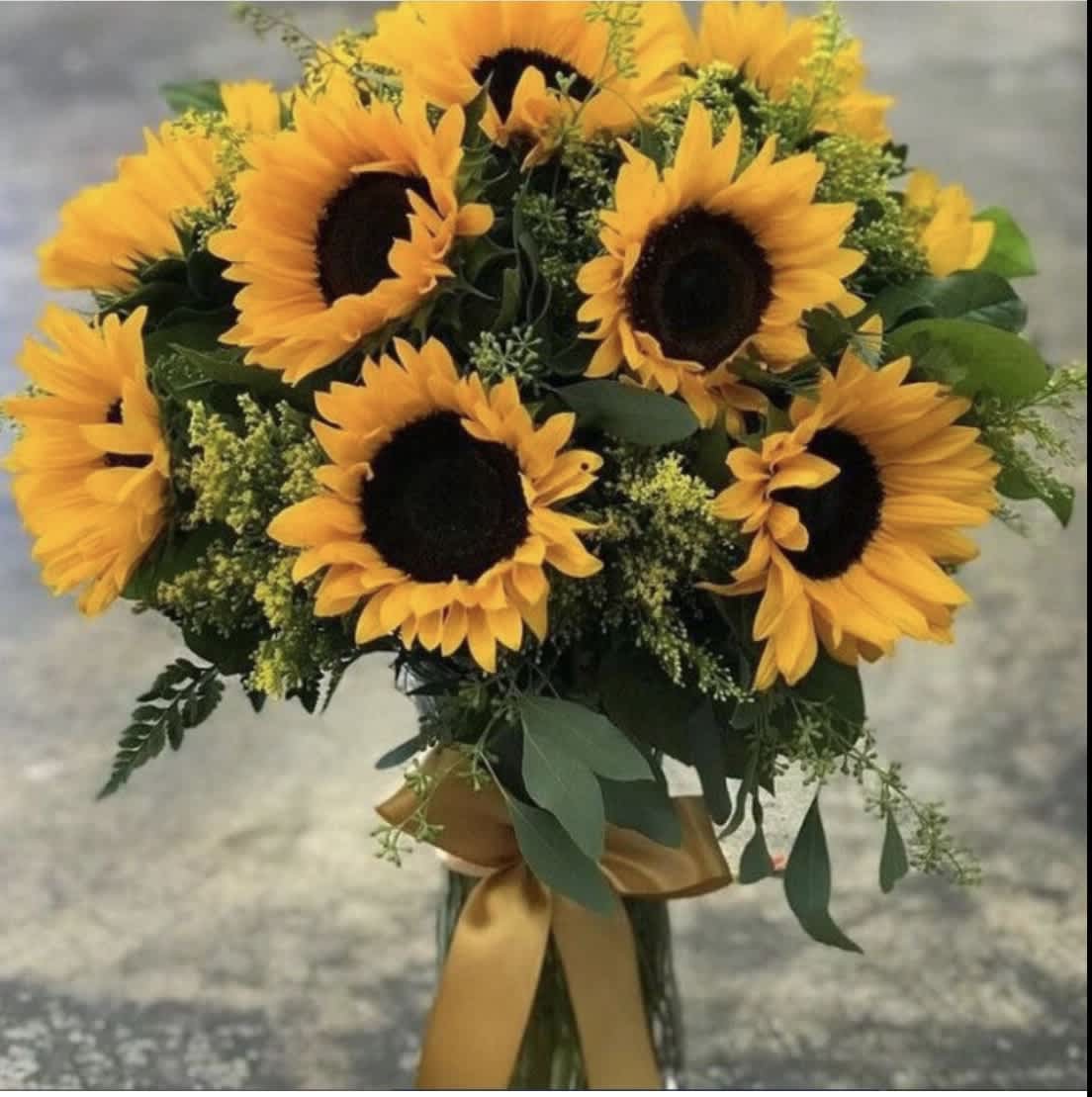 Bouquet of sunflowers with a gold ribbon