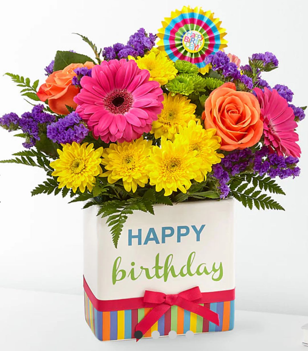 Bright mixed bouquet in a birthday gift box with a colorful topper