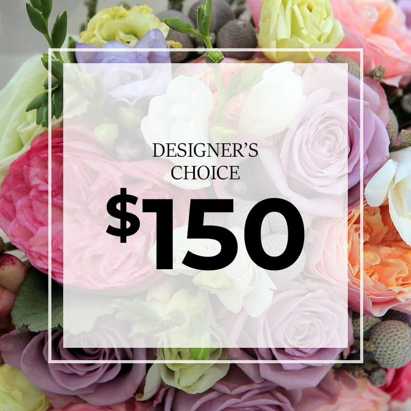 Graphic over pastel rose arrangement reading Designer's Choice $150