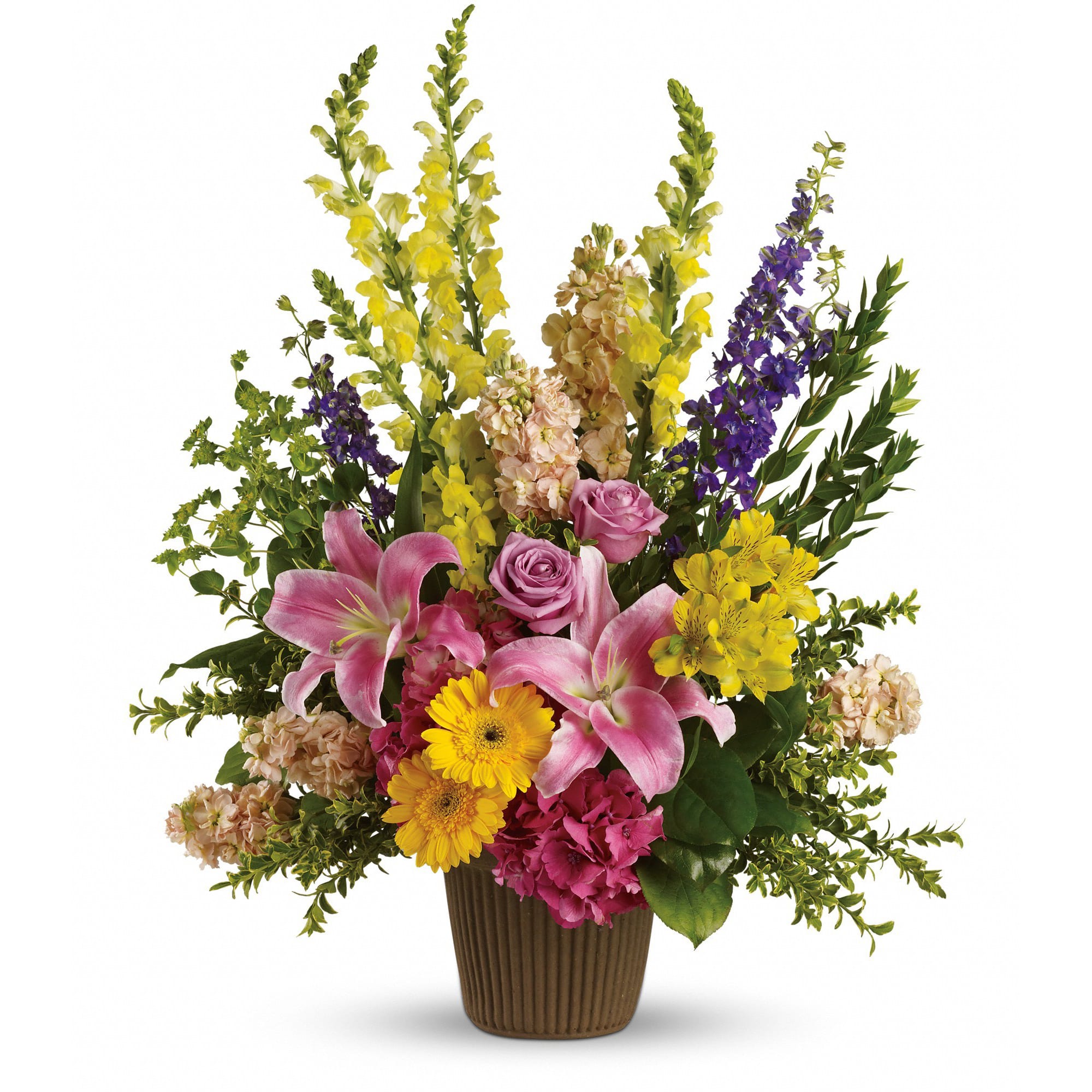 Mixed bouquet in a brown vase with pink lilies and yellow blooms