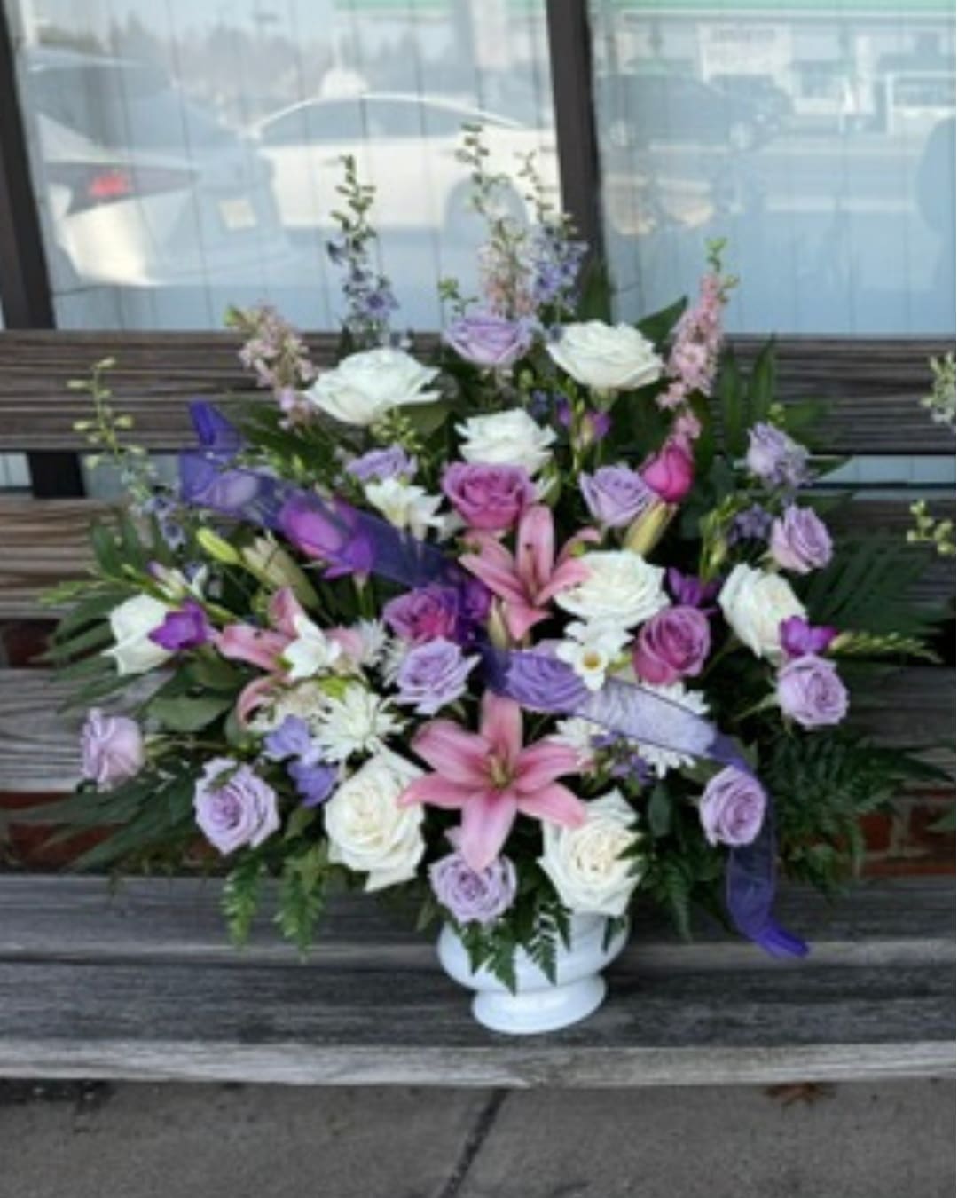 Cherished Arrangement - Purple and white arrangement to be displayed at funeral service. Vase arrangement makes for easy transport for the family to enjoy at home.