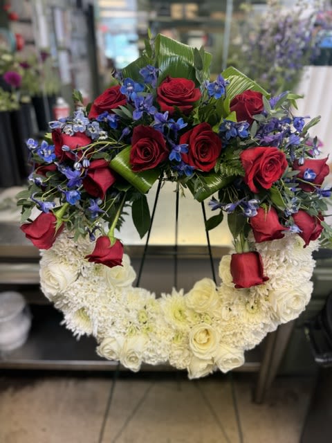 American Soul  - A perfect way to honor their beliefs and actions, this red, white, and blue wreath is a tribute to those who loved their country.  standard - 18" wreath deluxe - 24" wreath