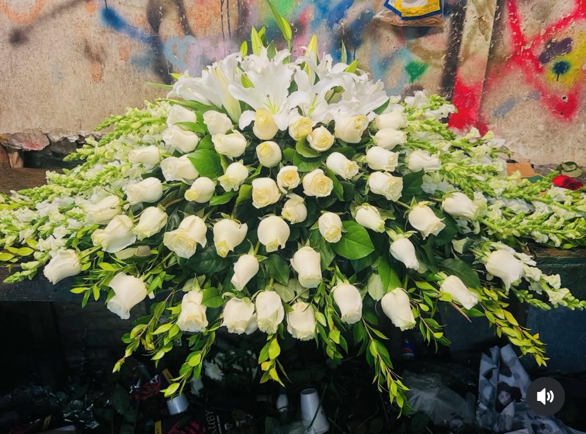 Large white floral spray with roses and lilies