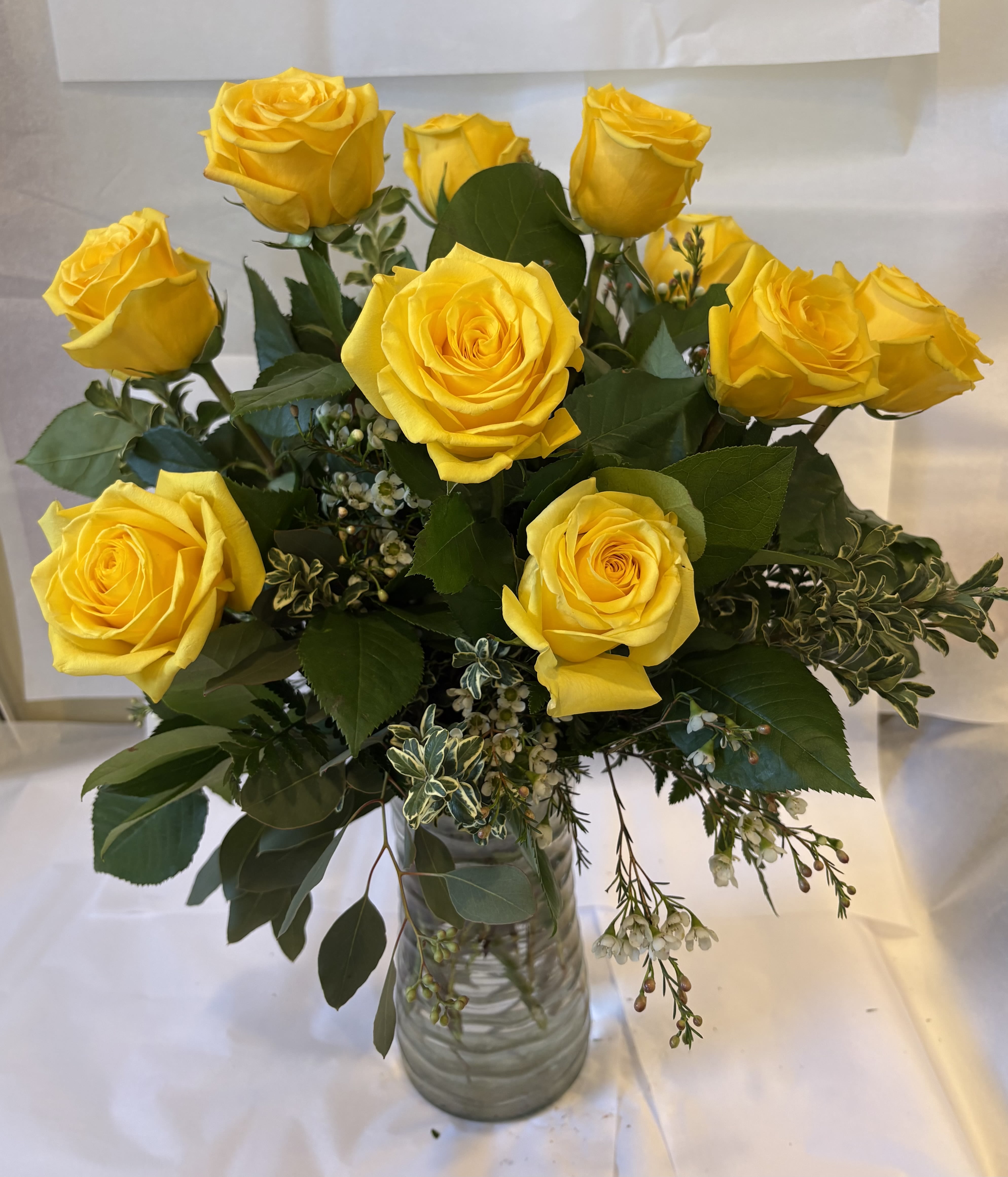 Bouquet of yellow roses in a clear glass vase
