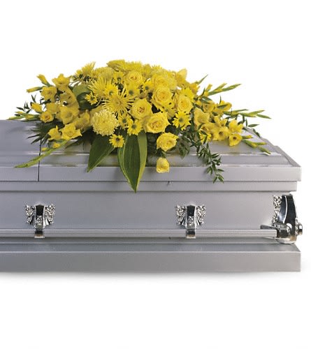 Graceful Grandeur Casket Spray - Joyous times and golden memories are recalled with this lovely half-couch casket spray that consoles the bereaved with a sunny array of beautiful blooms. A bevy of yellow blossoms such as roses gladioli chrysanthemums and more are perfectly arranged in this lovely casket spray. Approximately 44" W x 22" H Orientation: N/A As Shown : T242-1A