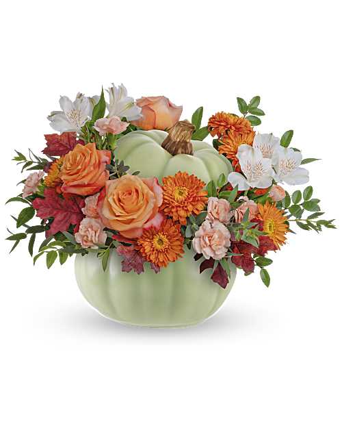 Pumpkin-shaped vase with orange and white flowers
