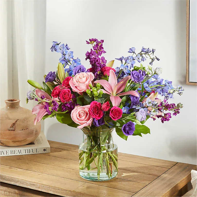 Arleen - Featuring an exquisite color palette and organic textures, this piece brings the serenity of nature indoors, cultivating a profound sense of well-being and affection.  All Occasion Crystal Clear Glass Vessel  Place your Order Online Monday to Saturday before 1:00 p.m. (E.T.) for same-day delivery. “Orders received after hours will be delivered the next business day”. Check our coverage area. Occasionally, substitutions of flowers and/or containers happen due to weather, seasonality, and market conditions which may affect availability. If this is the case with the gift you’ve selected, we will ensure that the style, theme, and color scheme of your arrangement are preserved and will only substitute items of equal value or higher value.  CARE INSTRUCTIONS Keep the flower arrangement hydrated with natural water and change the water every two days. Do not spray any cleaning product on the flower arrangement. Do not place heavy objects directly on the flower arrangement. Keep flower arrangements out of direct sunlight and extreme heat.