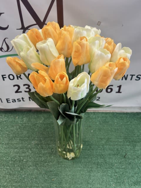 Silk Tulips  - Clustered orange and white silk tulips (tight-to-light bloom) arranged in a clear glass vase, spring-ready.