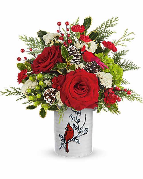 Teleflora's Christmas Cardinal Bouquet - Teleflora's Christmas Cardinal Bouquet captures the spirit of the season with bold red roses, textured greens, and bright berries. Hand-arranged in Teleflora's Woodland Cardinal Crock, this festive Christmas arrangement brings natural beauty and woodland charm to holiday décor. 