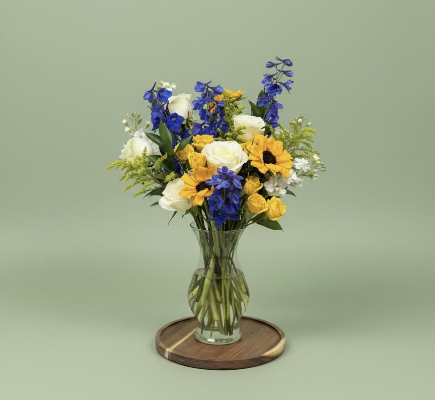 Blue Devils - Fun mix of Sunflowers, Blue Delphinium, and White Roses to show some Victor Pride!