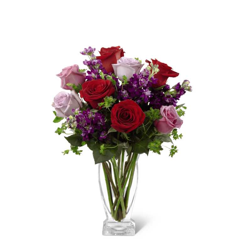 The FTD Garden Walk Bouquet - The FTD Garden Walk Bouquet is an exquisite expression of natural beauty and grace. Assorted lavender roses, rich red roses, purple stock and lush greens have a fresh look of floral elegance presented in a modern clear glass vase to create a sweet sentiment ideal to celebrate any of life's special moments. GOOD bouquet includes 12 stems. Approx. 15âH x 11âW. BETTER bouquet includes 16 stems. Approx. 17âH x 13âW. BEST bouquet includes 21 stems. Approx. 20âH x 16âW.