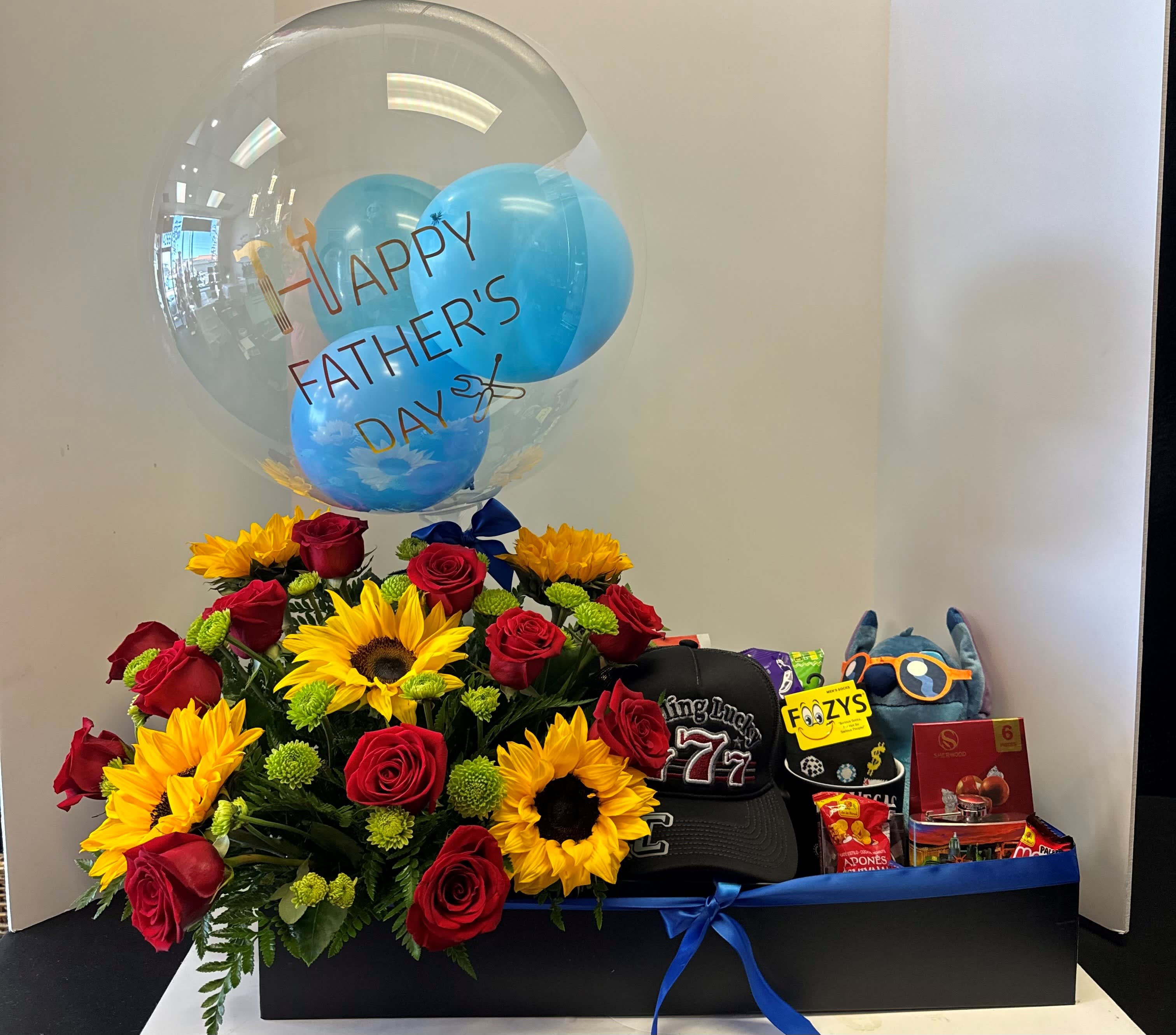 Gift box with red roses, sunflowers, balloons, and Father's Day items