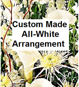All-white floral arrangement with lilies, calla lilies, and spider mums