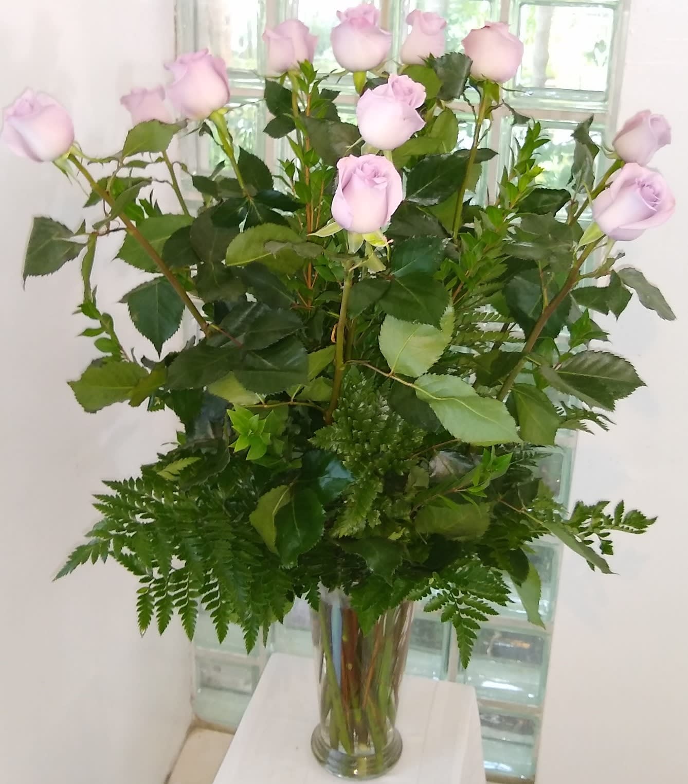 Long Stem Lavender Roses arranged in a vase - Lavender roses in a vase - soft, romantic blooms perfect for anniversaries, birthdays, get-well wishes, apologies or just because. Gentle, elegant gift for love and romance.