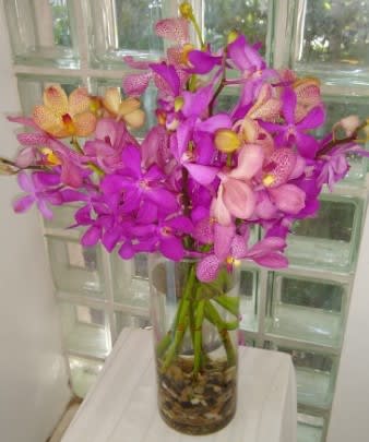 Irresistible Orchid Bouquet - The Irresistible Orchid Bouquet blooms with a sweet sophistication to make it an ideal flower bouquet set to celebrate any occasion. Pink and purple Mokara Orchids are elegantly arranged in a graphite round container for a modern look that will delight your special recipient at every turn.
