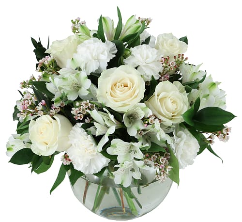 Sympathies Flower Bouquet - A pretty assortment of white and/or cream blooms rests in a clear glass bowl vase. Flowers include roses, carnations, alstroemeria and waxflower, plus complementary greenery