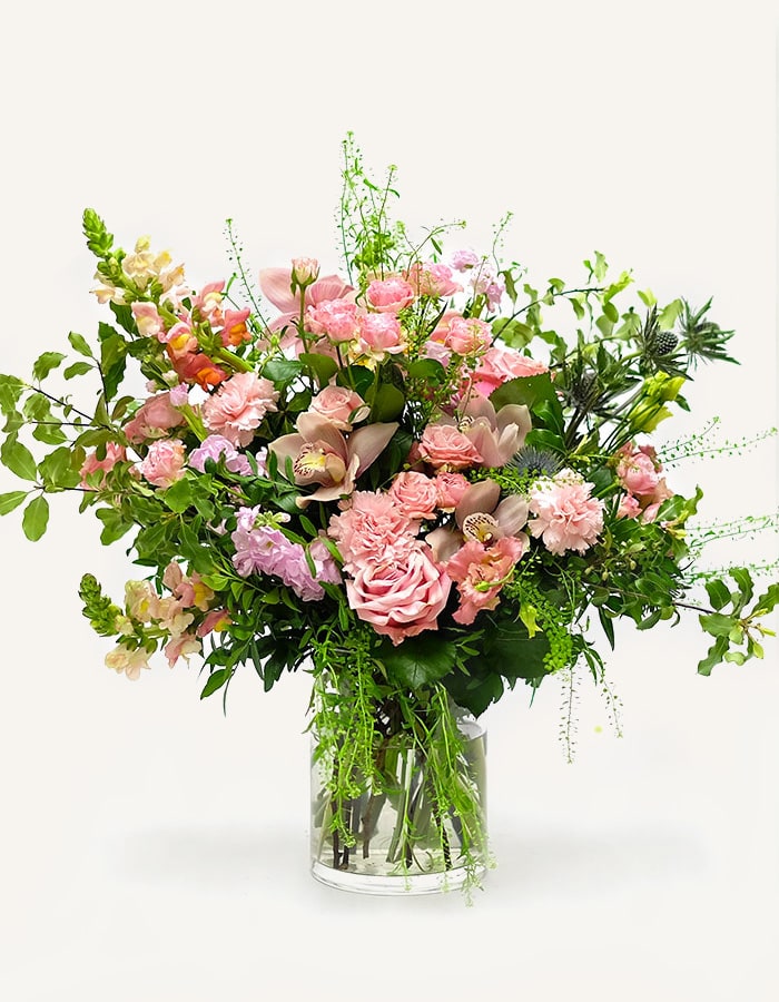 Special Moments flower Bouquet - This gorgeous bouquet has been designed to feature our favourite flowers in an array of pretty pink colouring. Lisianthus Roses, Snap Dragons, Orchids and thistles. A classic A-symmetric design 