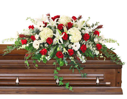 PEACE ALWAYS CASKET SPRAY - Remember your loved one with an elegant casket piece that embraces their sophistication and spirit while giving comfort to those who are mourning with its gentle beauty. The Peace Always casket spray will ease the hearts of the friends and family with its calming white hydrangeas and embody their vibrant spirit with red roses in a sea of ivy. 