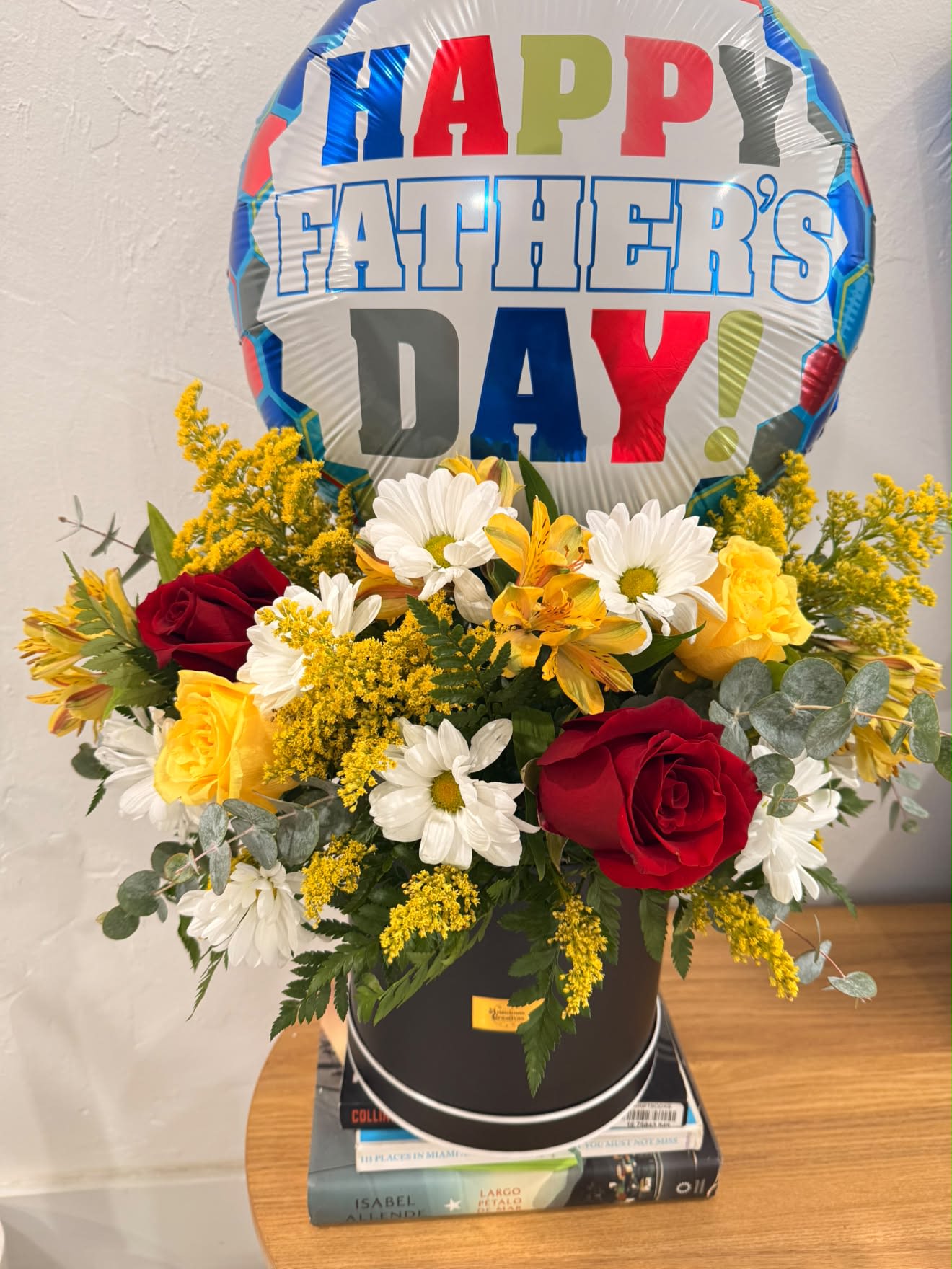 Floral Arrangement with Balloon -  Flower varieties and balloon designs may vary based on seasonal availability while maintaining the overall style, color palette, and premium presentation.  Perfect For:  * Birthdays * Anniversaries * Congratulations * Get Well Soon * Thank You * New Baby * Graduation * Thinking of You * Any Special Occasion  Features:  * Premium fresh seasonal flowers * Elegant hat box presentation * Themed balloon customized for the occasion * Handcrafted by expert florists * Same-day flower delivery available in Miami