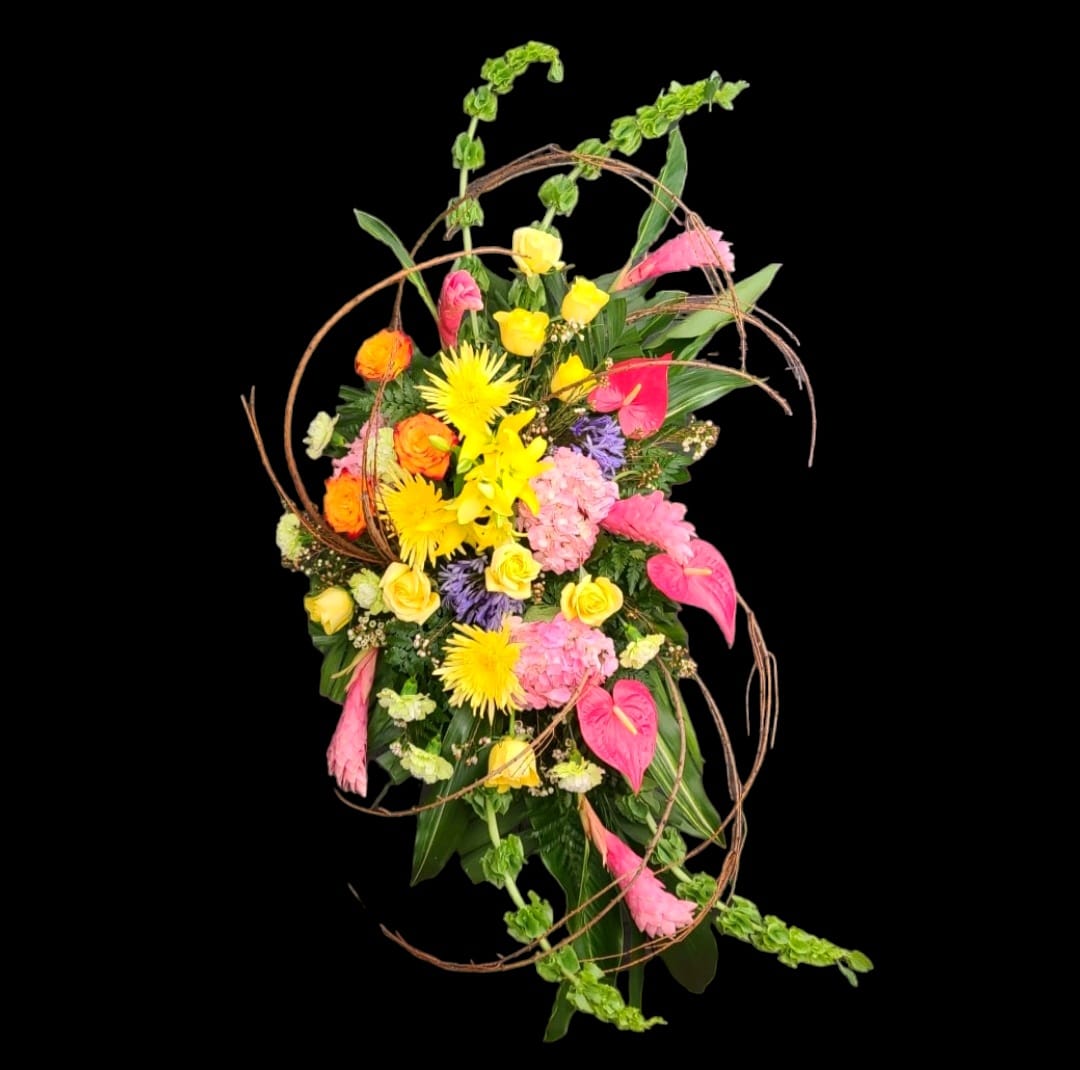 Tall mixed bouquet with pink, yellow, and orange flowers