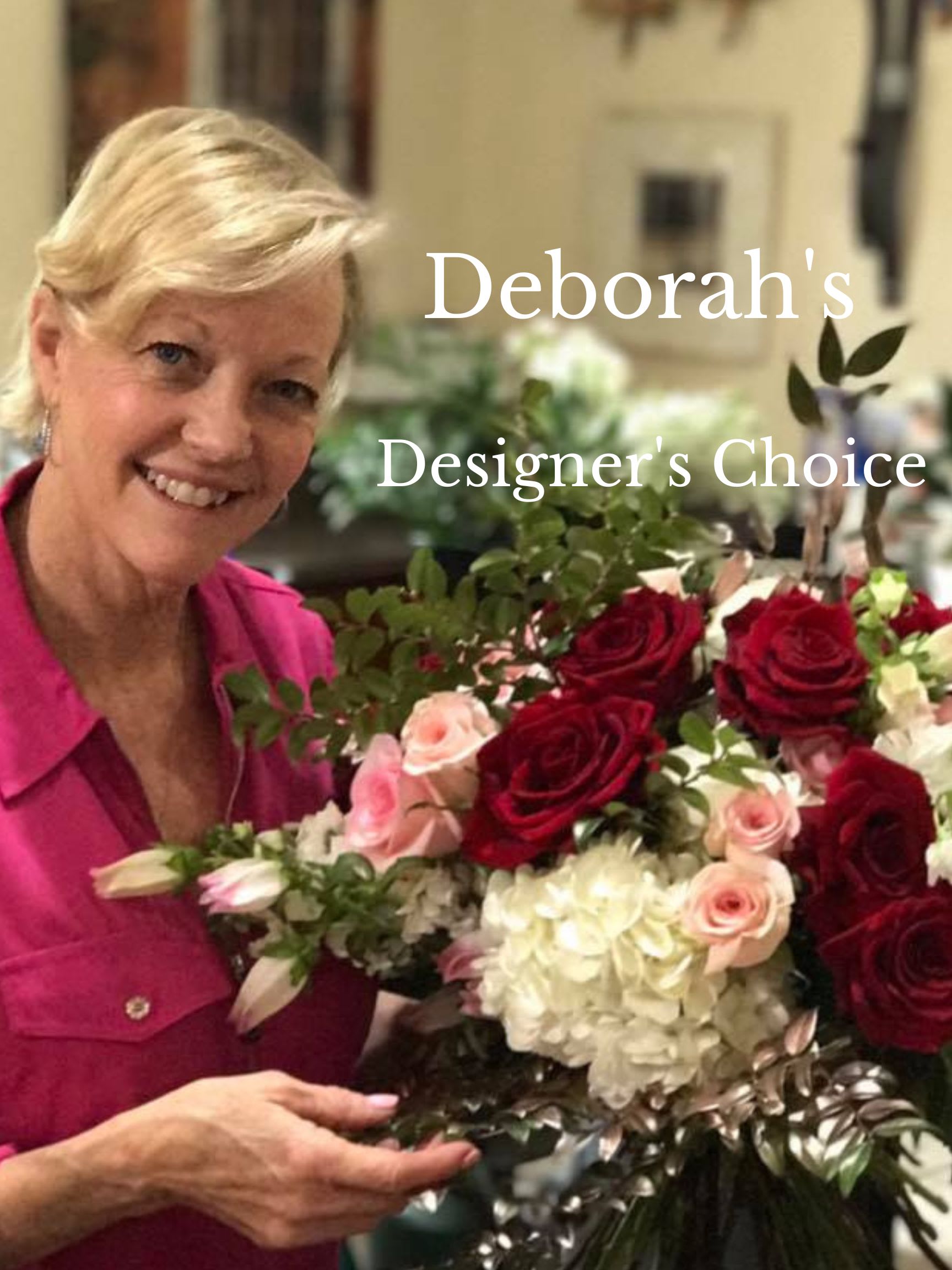 Woman holding a bouquet of red, pink, and white flowers