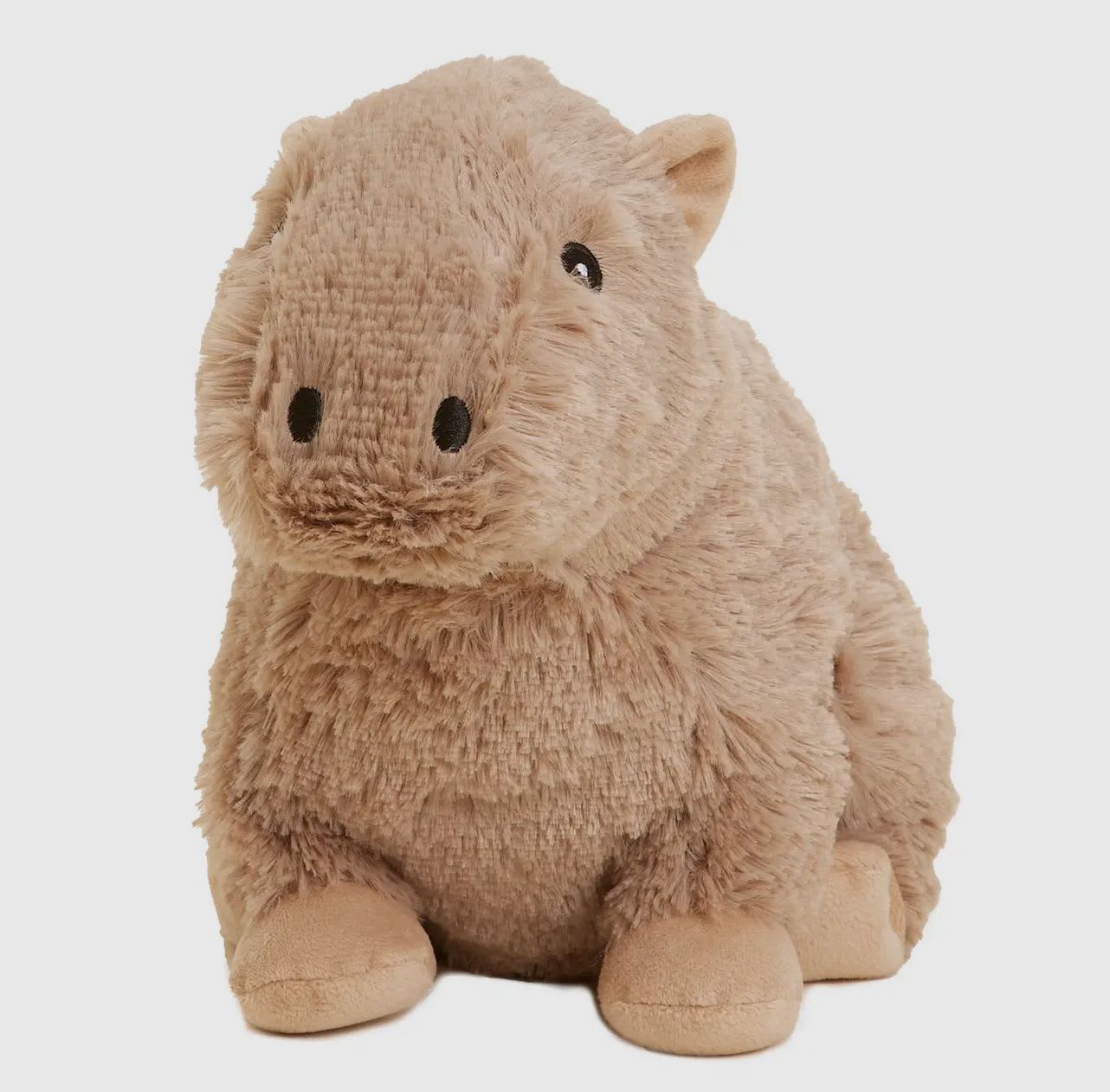 Plush hippo toy in tan fur on a white background