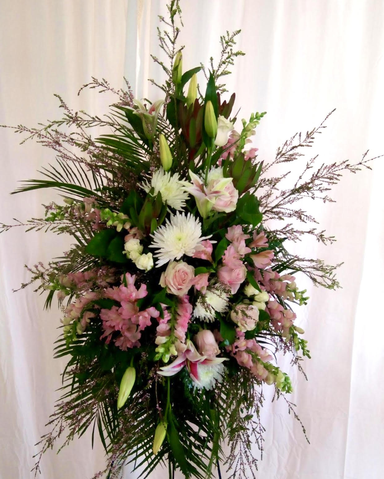 Tall floral standing spray with pink and white blooms