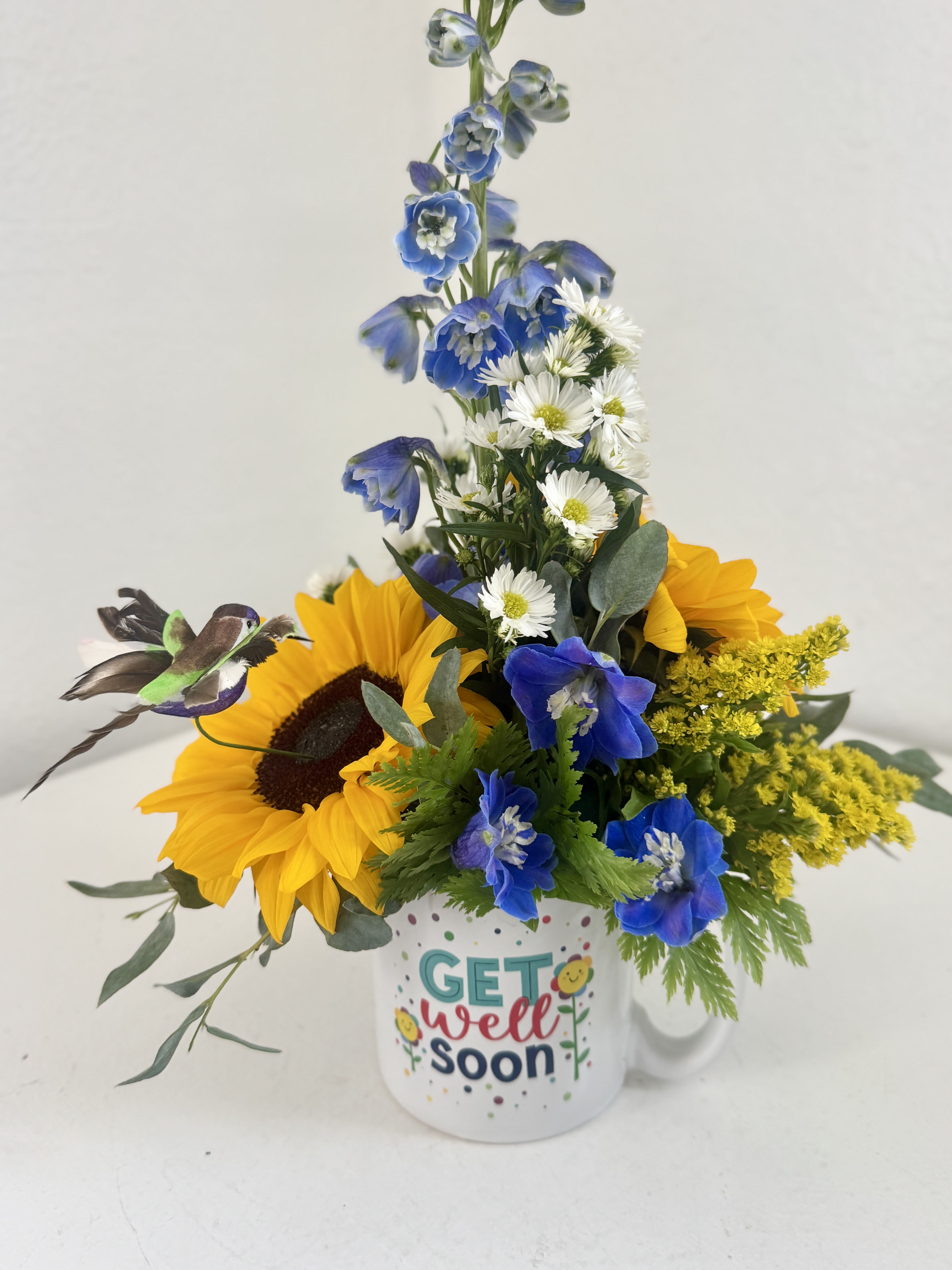 Get Well Soon Mug - A unisex reusable mug with "Get Well Soon" on both sides filled with gorgeous blooms! Please indicate if you'd like a certain color palate otherwise we will make it similar to the picture provided.