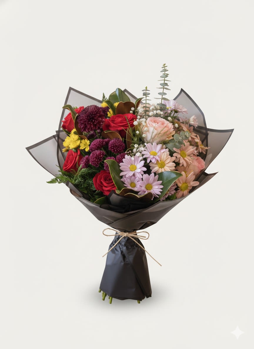 Bouquet of mixed flowers wrapped in dark paper with a bow