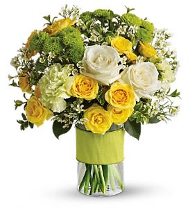 Your Sweet Smile - You could call or email that special someone, but why not put your feelings into flowers? She'll love this elegant array of white and yellow roses and other favorites in a stylish cylinder vase. She'll want to thank you in person.  This charming bouquet includes white roses, yellow spray roses, green carnations, green button spray chrysanthemums and white waxflower accented with assorted greenery. Delivered in a glass cylinder vase.  Approximately 12 1/2" W x 14" H  Orientation: All-Around  As Shown : TEV11-1A Deluxe : TEV11-1B Premium : TEV11-1C