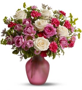 Pink and white rose bouquet in a pink vase
