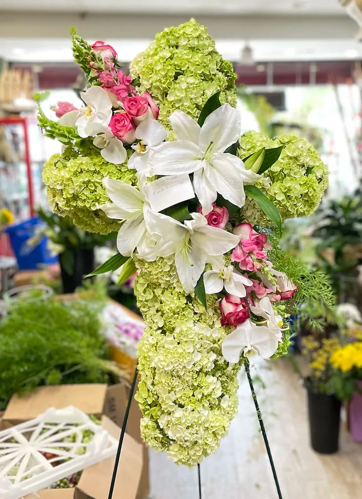 Peace &amp; Prayers (Deluxe Shown) - Pride, dignity, admiration, and faith are on beautiful display in this moving sympathy arrangement. It's a meaningful way to deliver your heartfelt message. 
