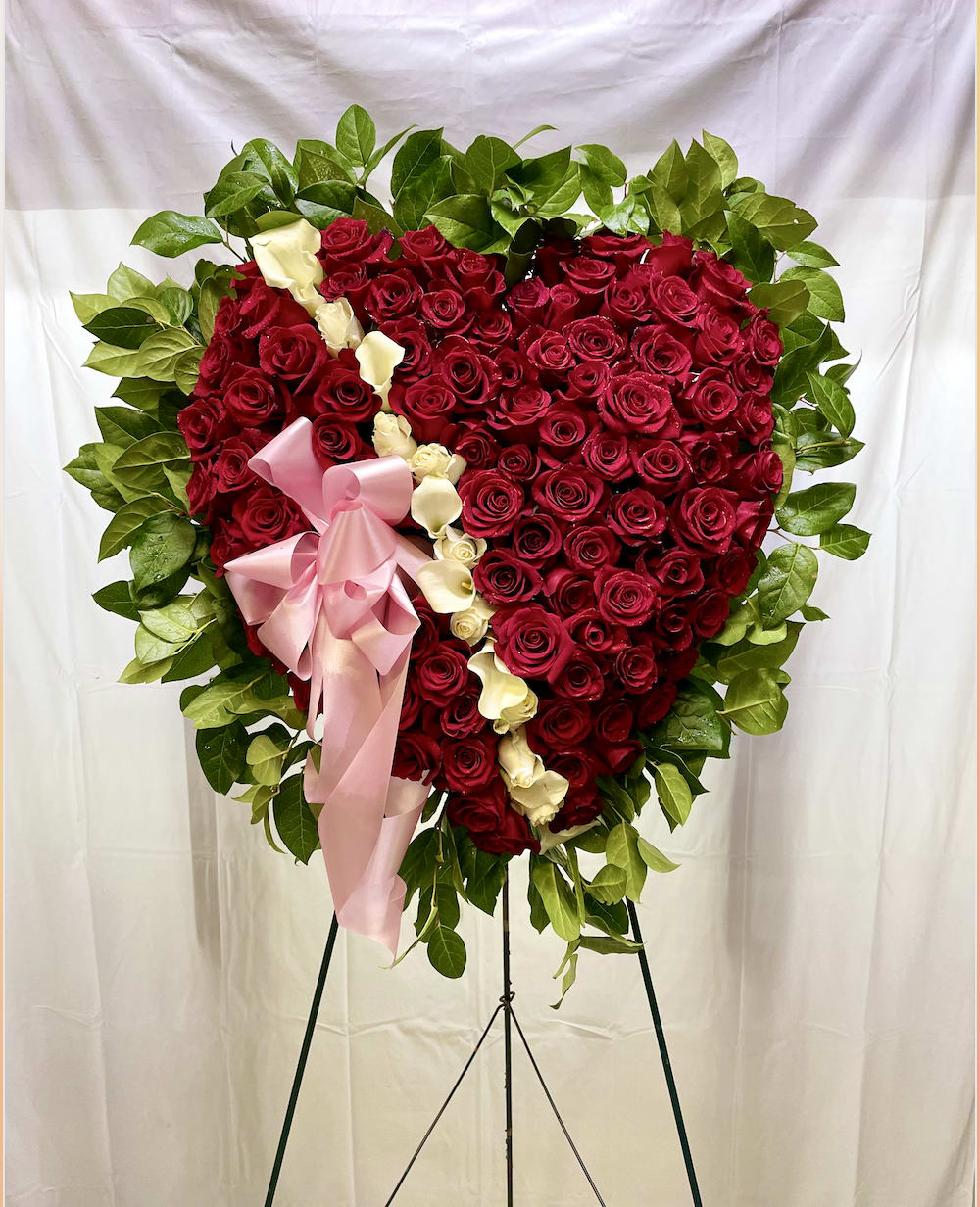 Red Sympathy Full Heart - Our Red Sympathy Full Heart is an exquisite standing arrangement artistically created with all red roses and calla lilies and white roses down the middle. (picture shown is a deluxe size, ribbon interchangeable)