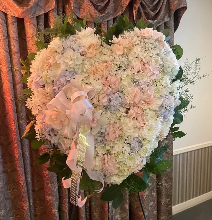 Blessed Heart - Remember a loved one's generous heart with this arrangement in a classic heart shape, a declaration of eternal love and devotion. 