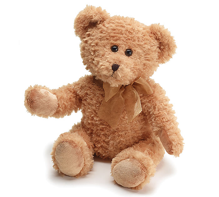 Plush teddy bear with a ribbon bow on a white background