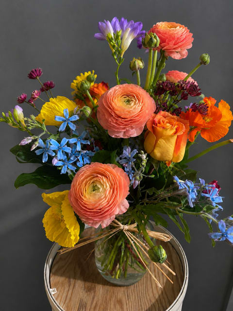 Fall Frenzy - A beautiful array that includes ranunculas, roses, freesia, astriantia, and other wildflowers. A sure fire hit for any occasion.